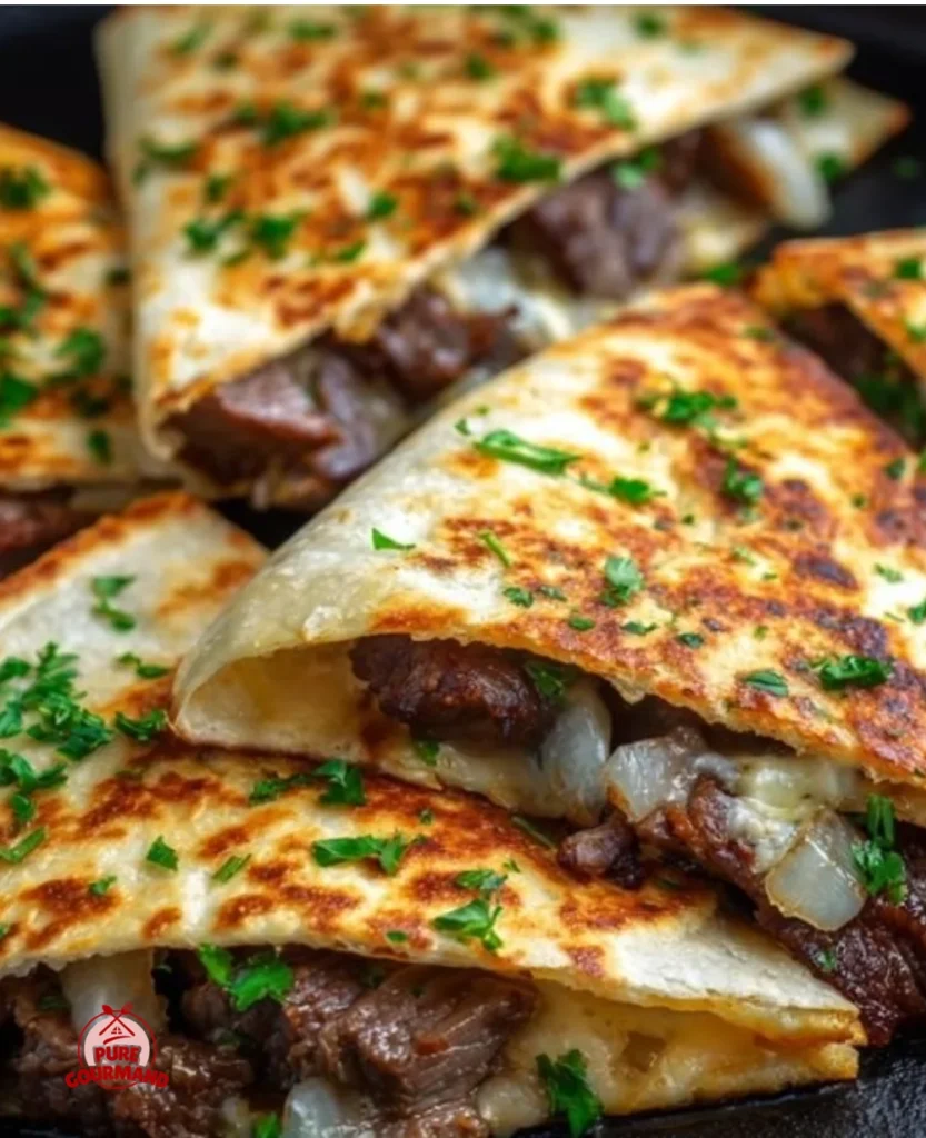 Delicious Blackstone steak and cheese quesadillas freshly grilled and served hot.