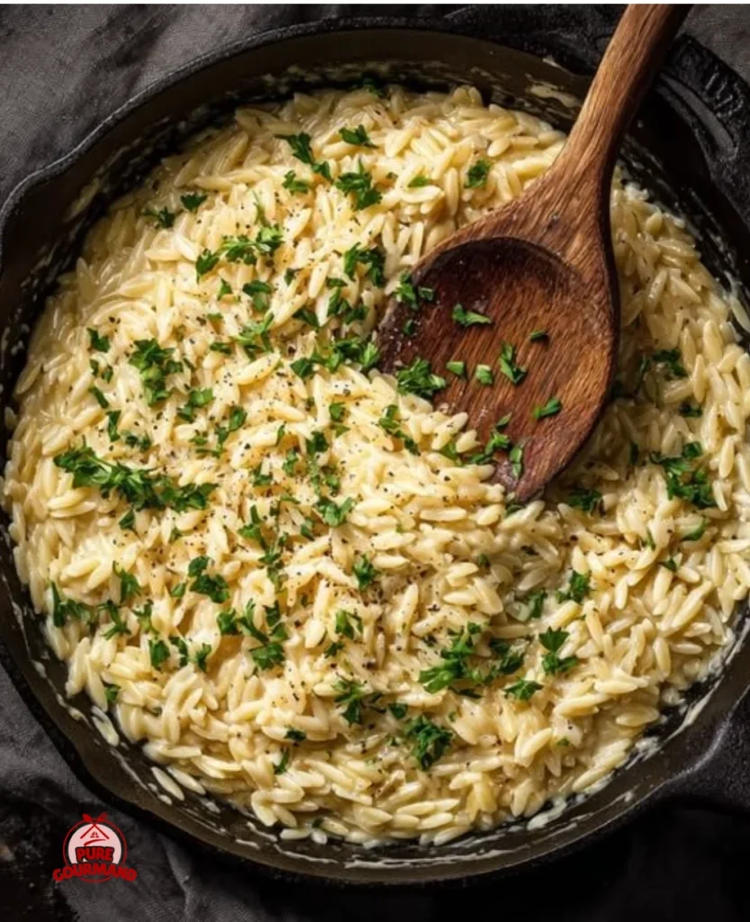 Creamy Garlic Parmesan Orzo in a skillet, a delicious one-pan dinner dish