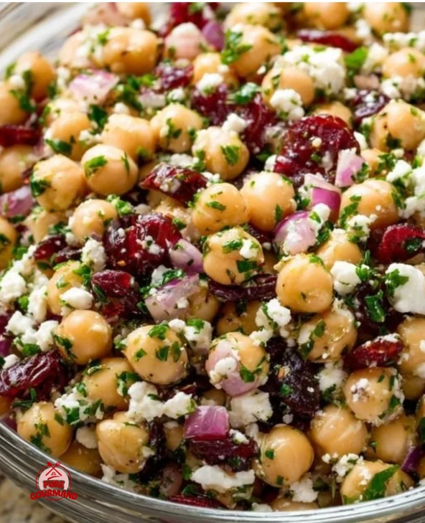Feta and Cranberry Chickpea Salad served in a bowl, highlighting fresh ingredients.