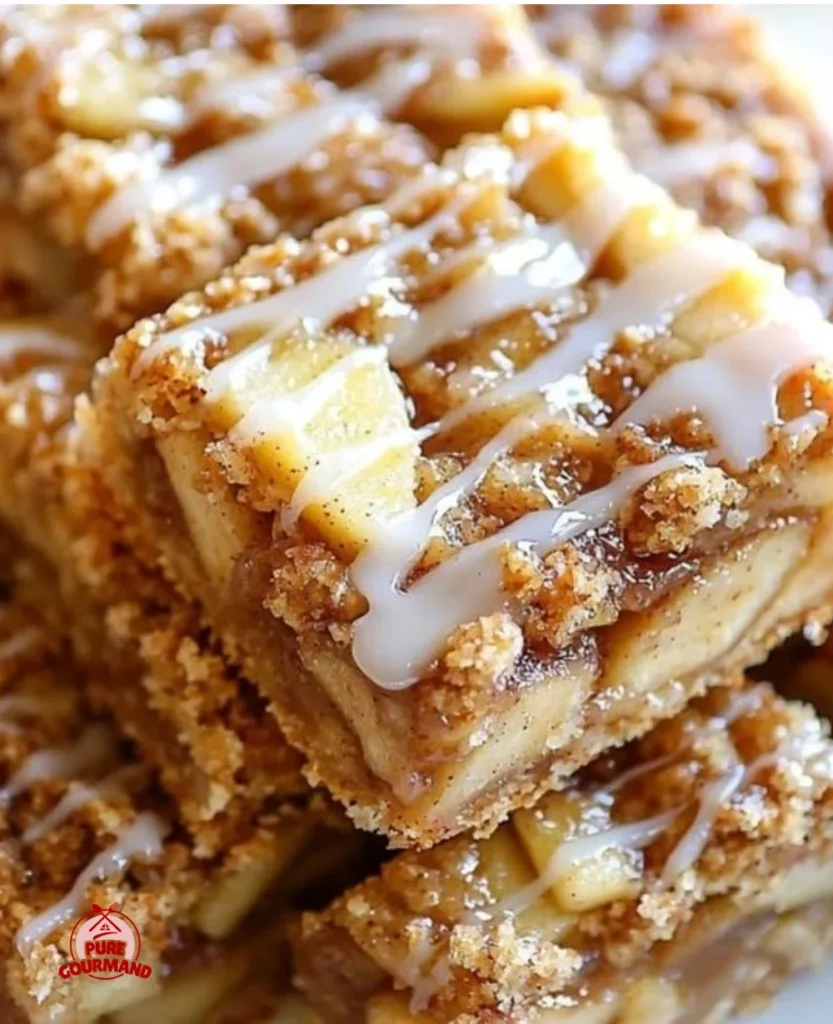 Homemade apple bars topped with cinnamon and nuts