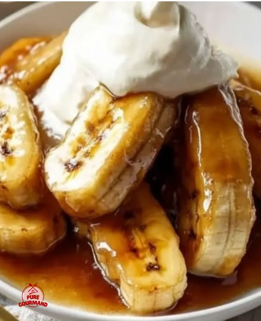 A delicious serving of Bananas Foster with caramel sauce and vanilla ice cream.