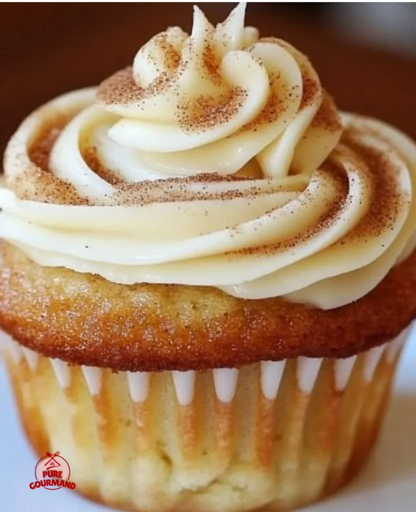 Freshly baked cinnamon rolls topped with creamy icing