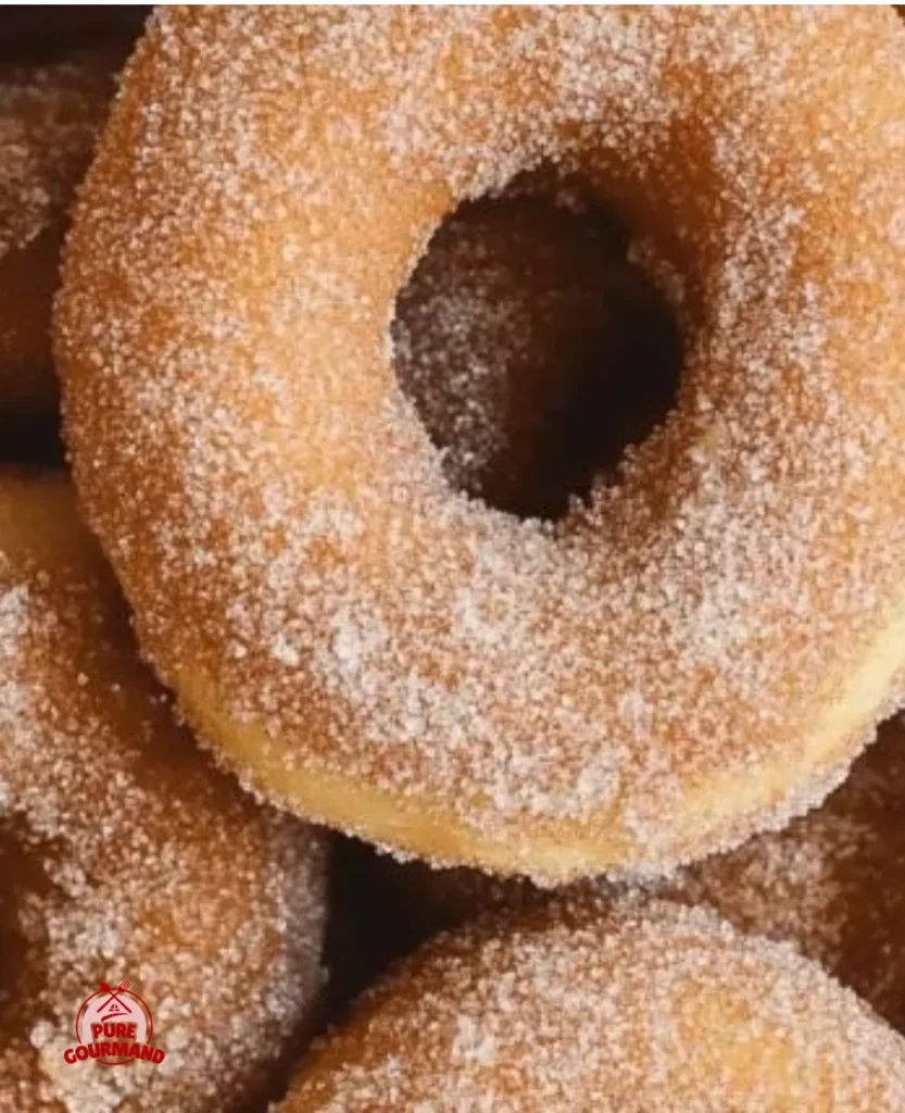 Delicious homemade apple cider donuts dusted with cinnamon sugar.