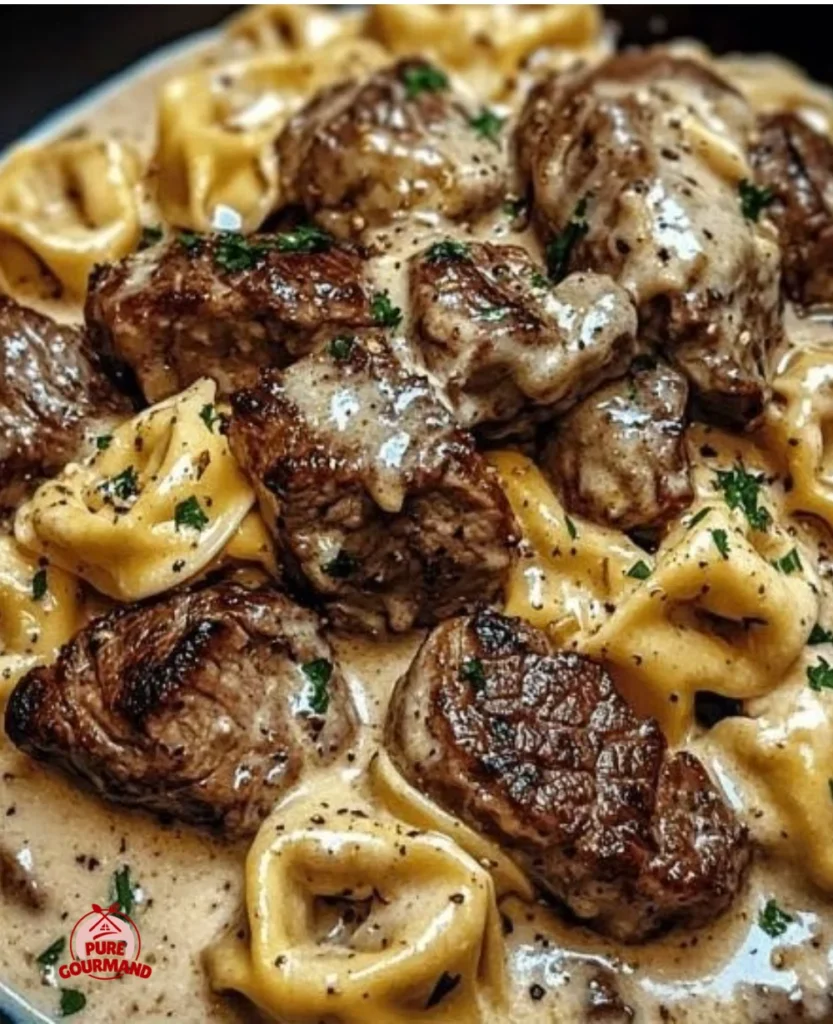 Creamy garlic steak tortellini with seared steak and fresh herbs
