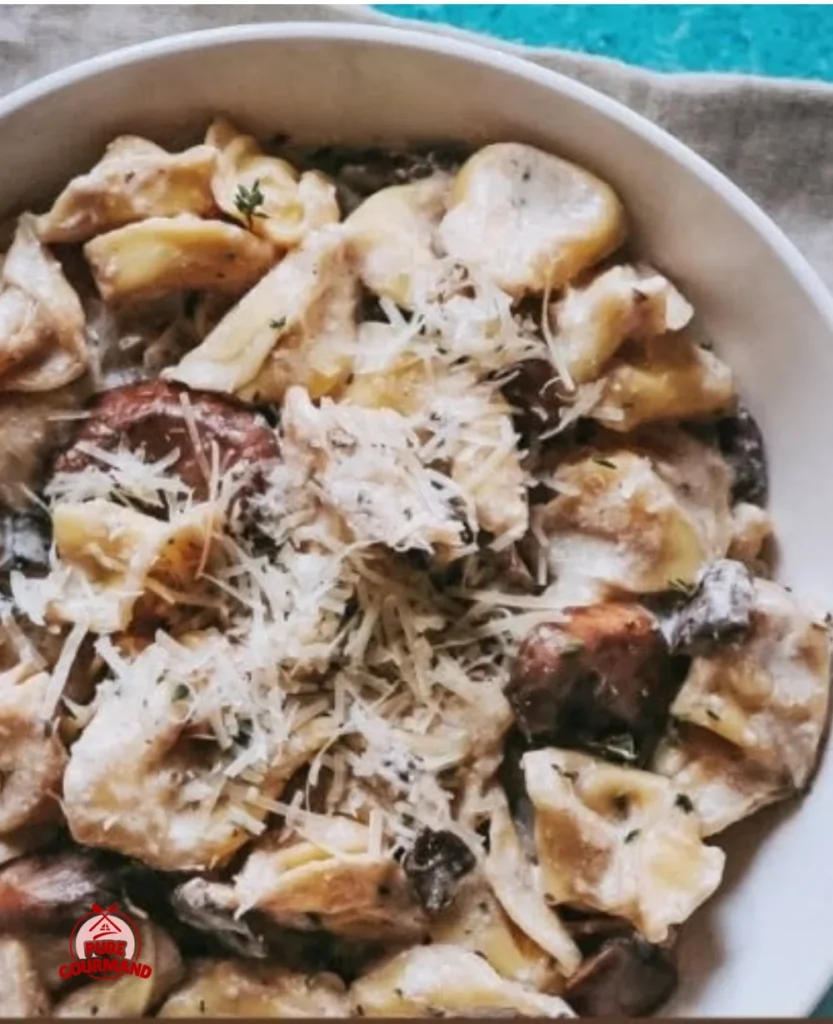 Creamy tortellini Alfredo served in a bowl with garnish