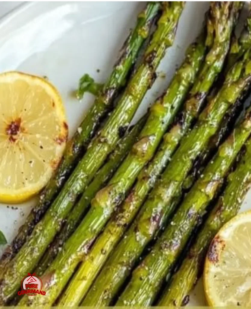 Crispy air fryer asparagus served on a plate with seasoning