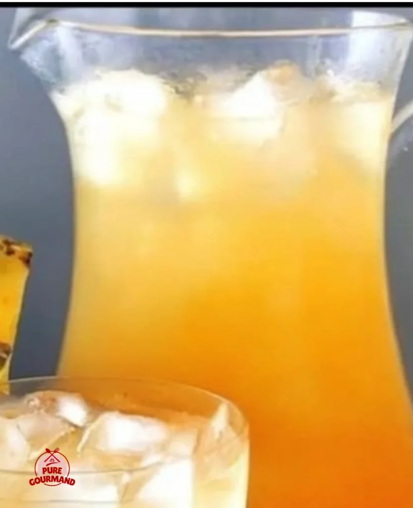 Refreshing easy summer pineapple lemonade punch in a glass.