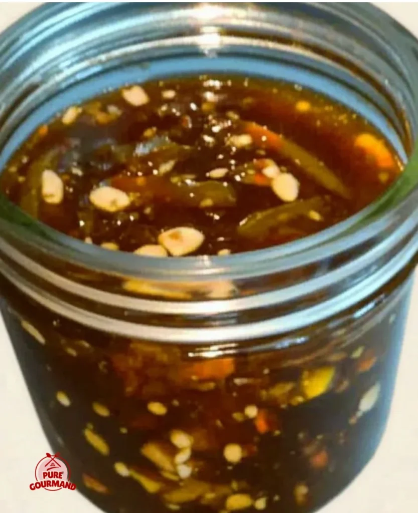Variety of stir-fry sauces in jars with vegetables in the background