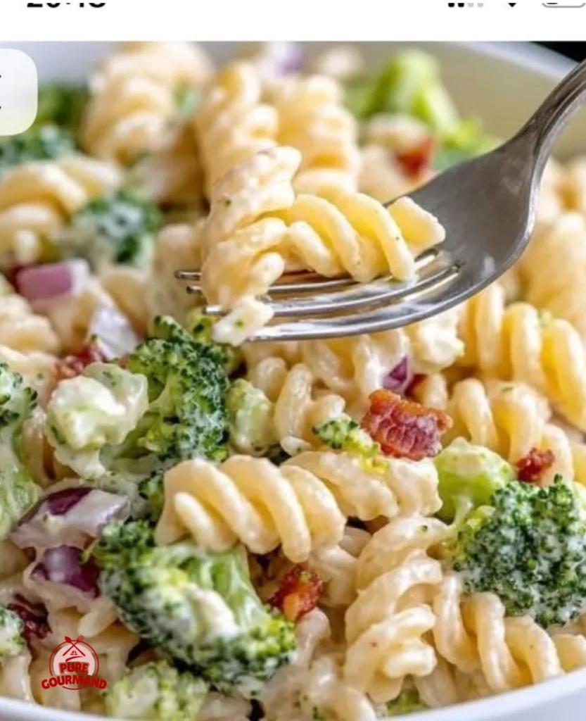 Fresh broccoli pasta salad with colorful vegetables in a bowl