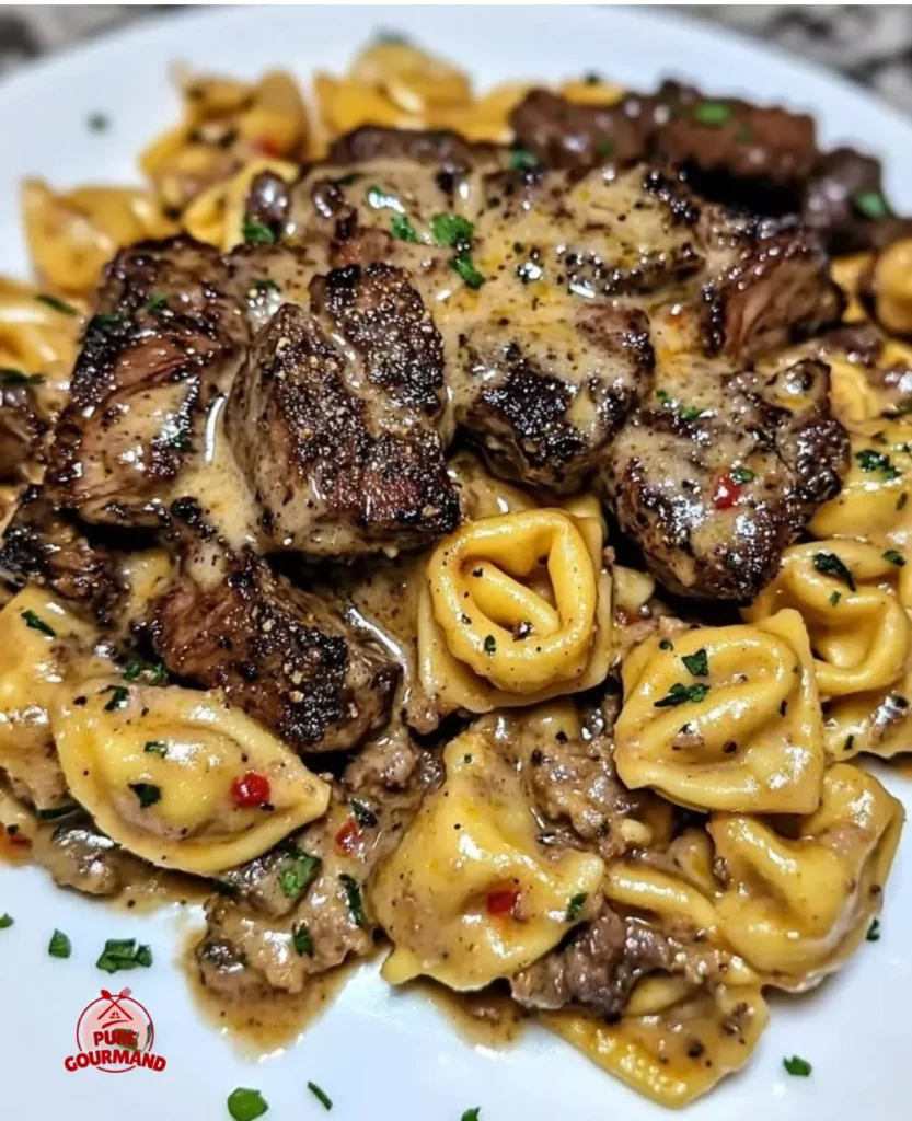 One-Pan Cowboy Butter Tortellini with steak bites in a skillet