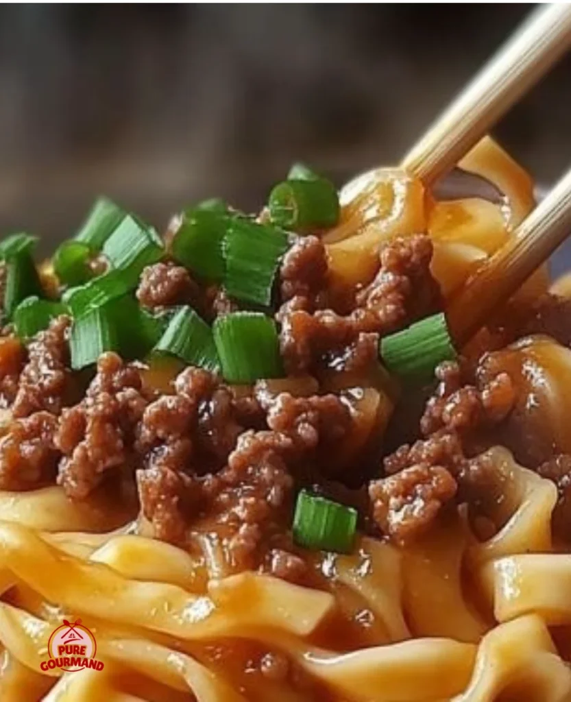 Delicious bowl of Mongolian ground beef noodles stir-fry with colorful vegetables