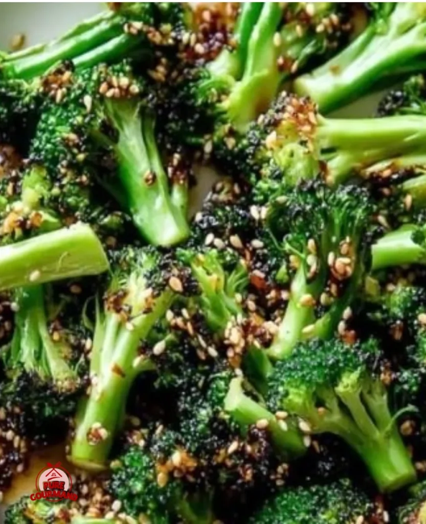 Broiled broccoli with spicy sesame and scallion seasoning on a plate