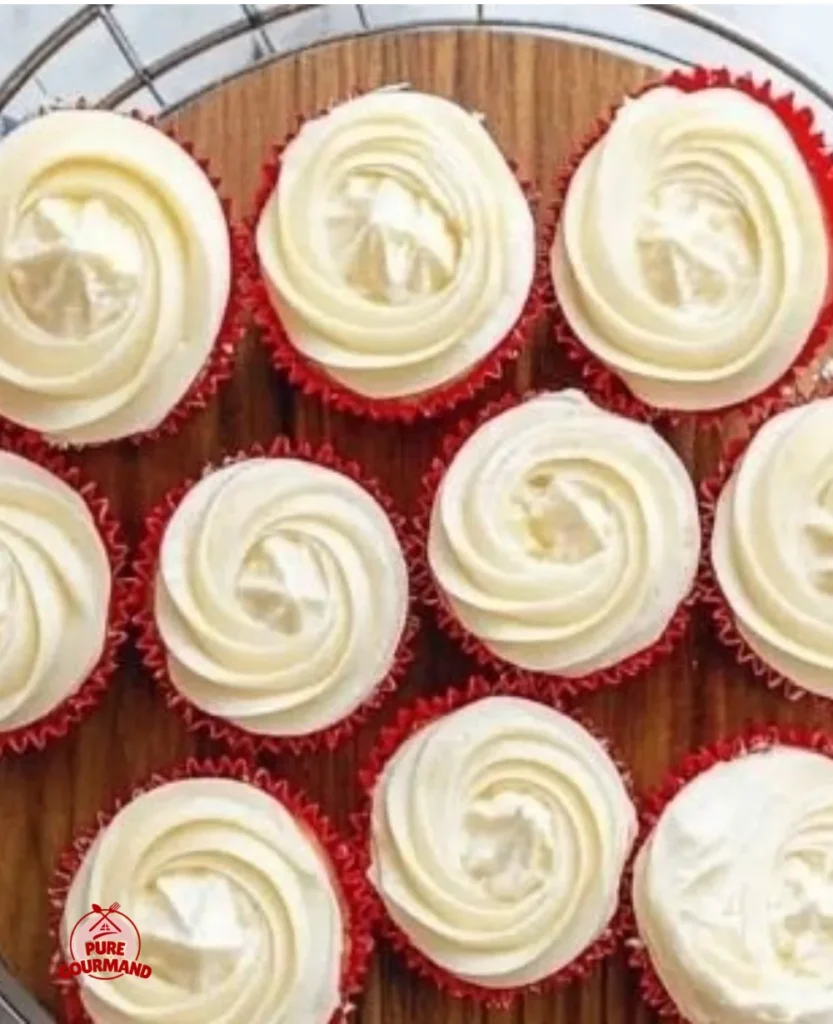Deliciously creamy and smooth cream cheese frosting on a cake slice