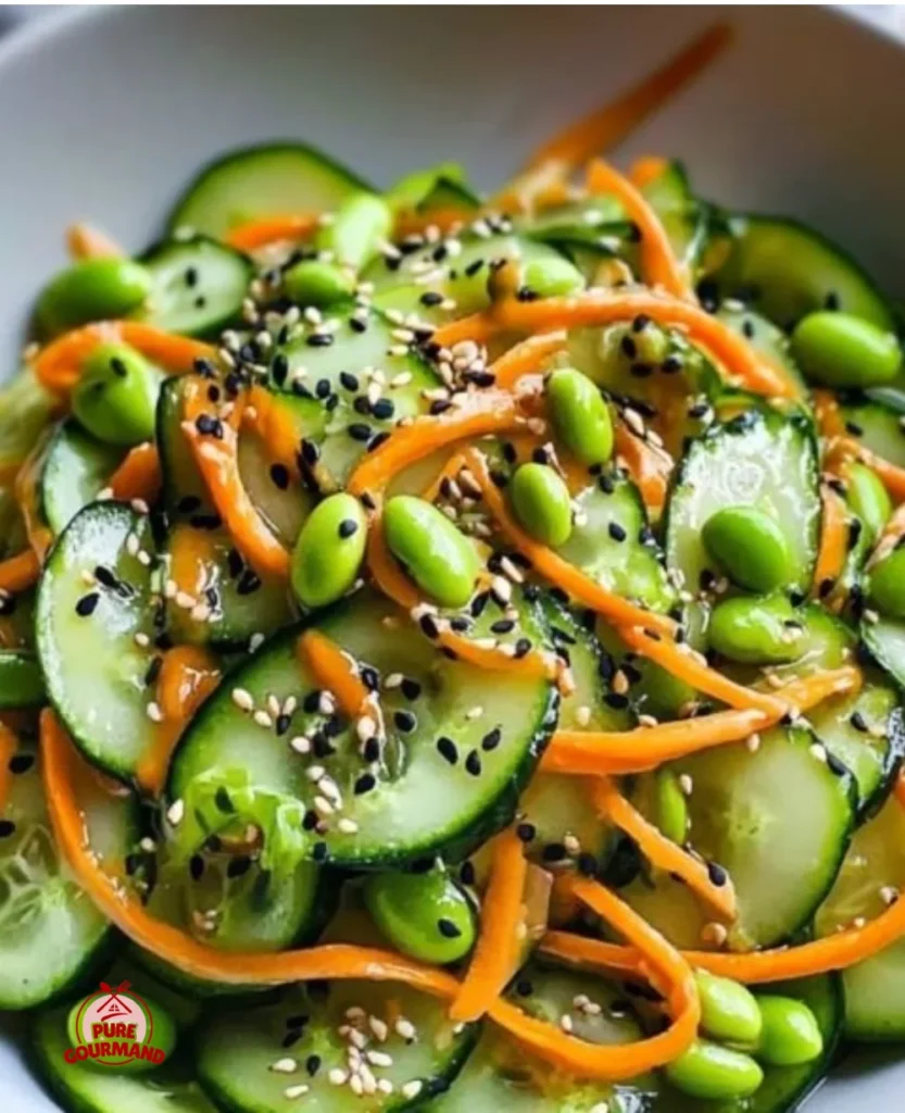 Chilled ginger miso cucumber salad served in a bowl, garnished with sesame seeds.