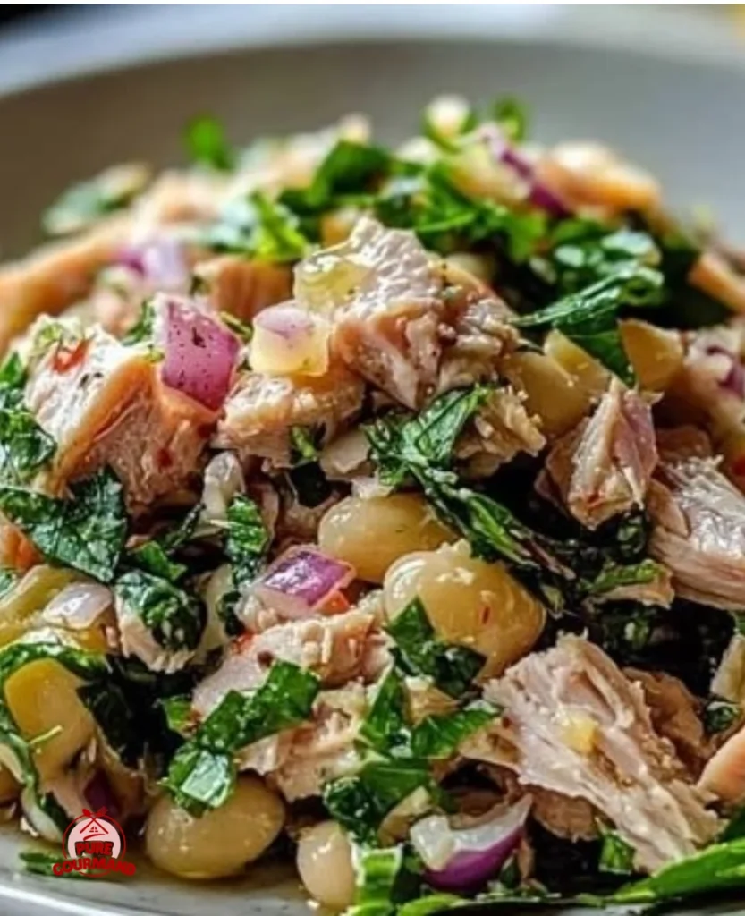 Delicious Tuna and White Bean Salad in a bowl with fresh ingredients.