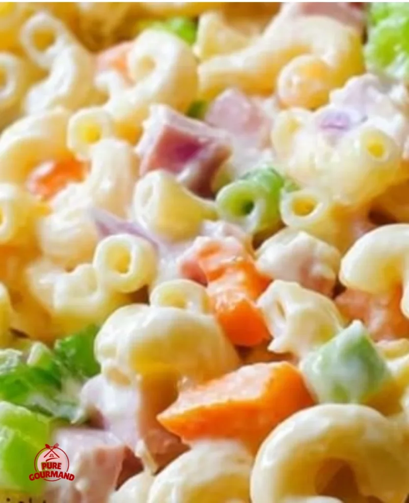 Bowl of classic macaroni salad with vegetables and dressing