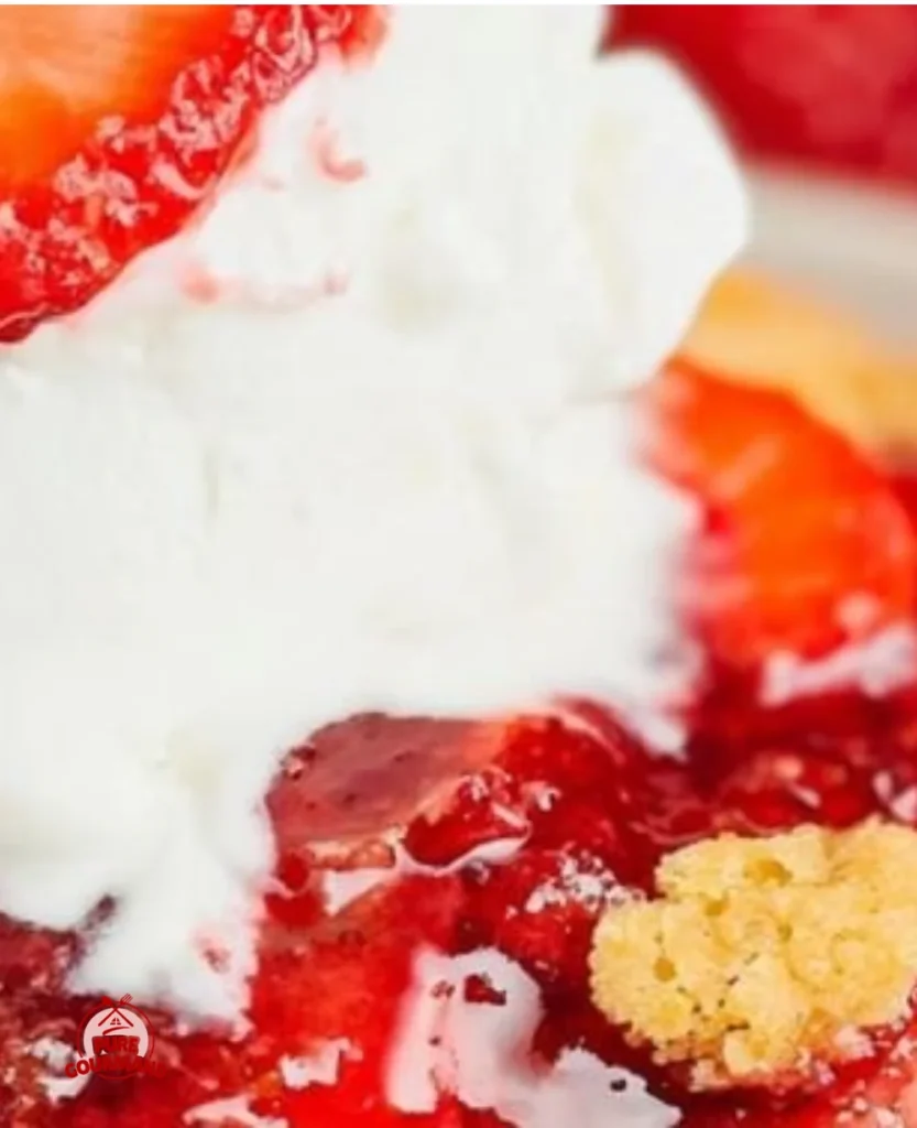 Delicious easy strawberry dump cake served on a plate with strawberries