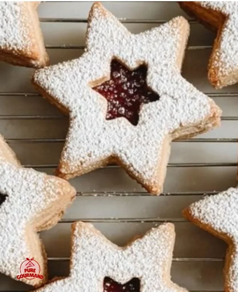 Delicious homemade Linzer Cookies with jam filling, traditional Austrian dessert.