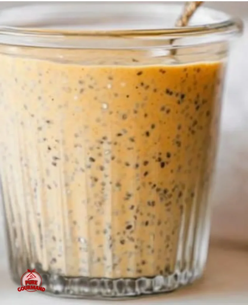 Bowl of creamy Pumpkin Chia Pudding topped with cinnamon and pumpkin seeds