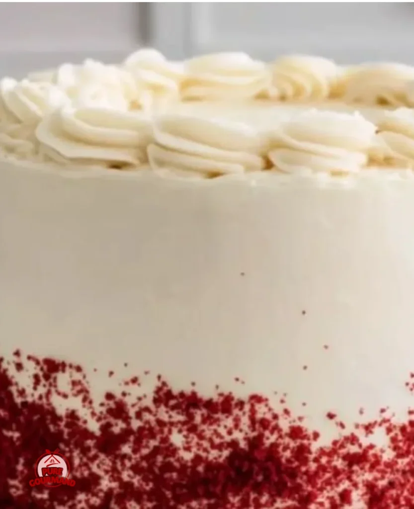 Delicious slice of classic Red Velvet Cake topped with cream cheese frosting.