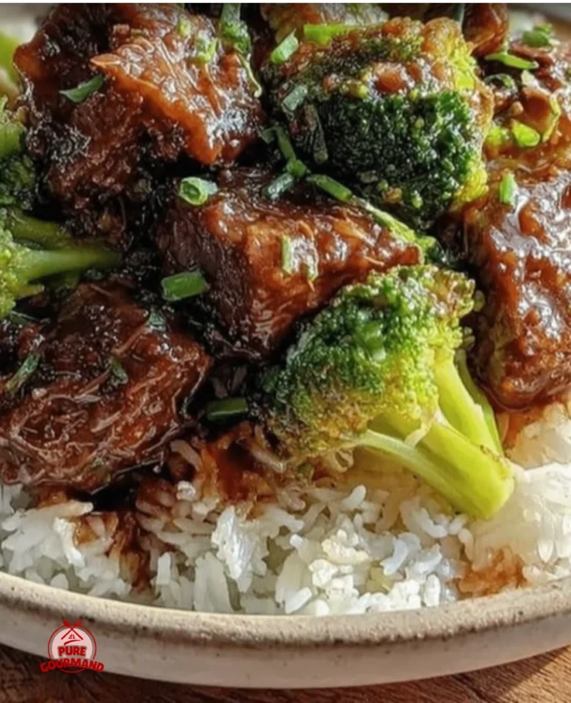 Delicious crockpot beef and broccoli with jasmine rice served in a cozy bowl.