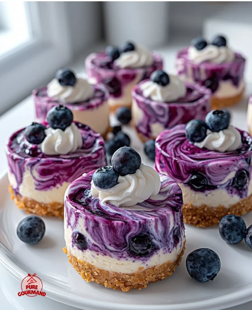 Mini blueberry cheesecakes delicately topped with fresh blueberries