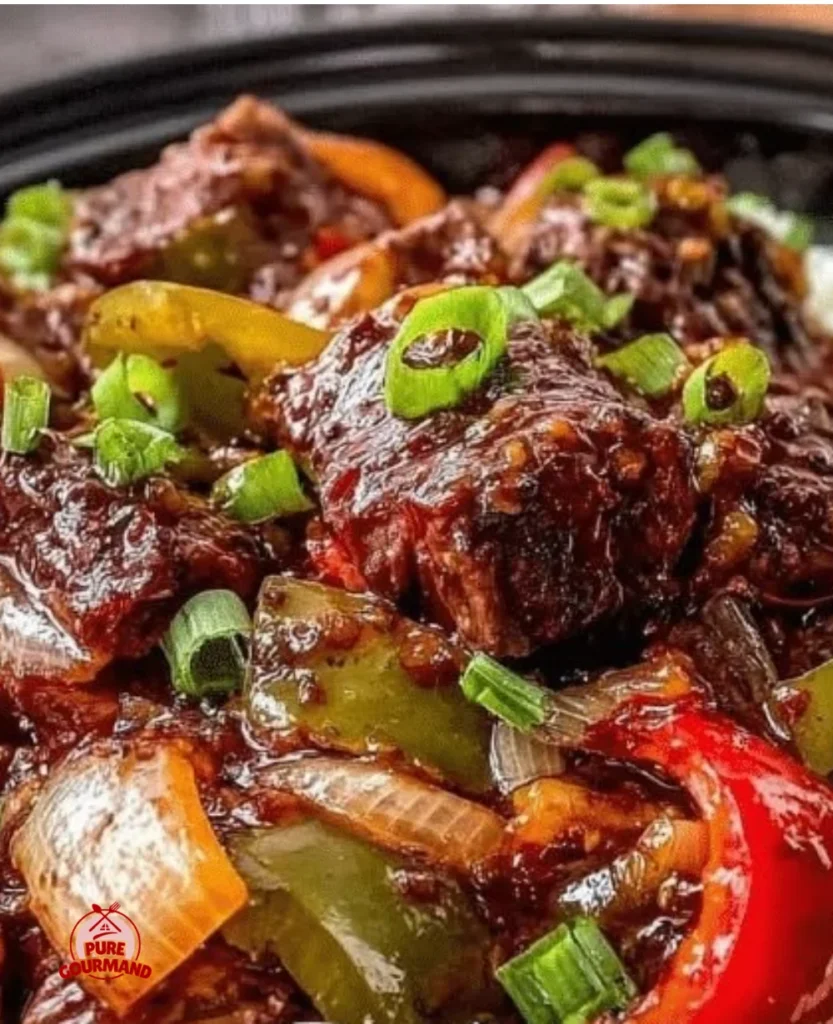 Savory slow cooker pepper steak served with bell peppers and sauce
