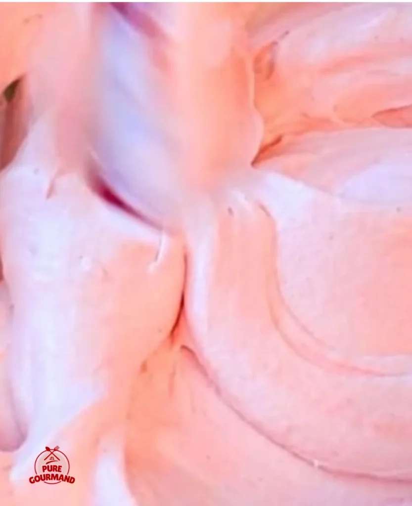 Delicious strawberry cheesecake mousse topped with fresh strawberries and whipped cream.