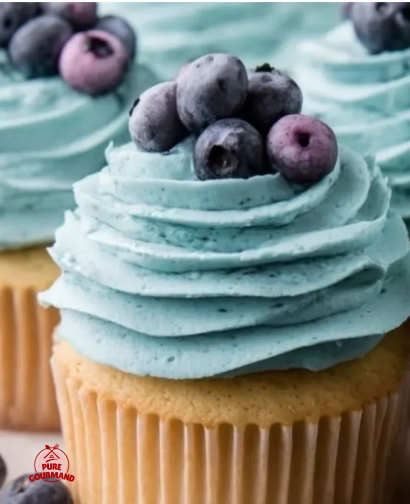 Delicious blueberry cream cheese frosting spread on a cupcake