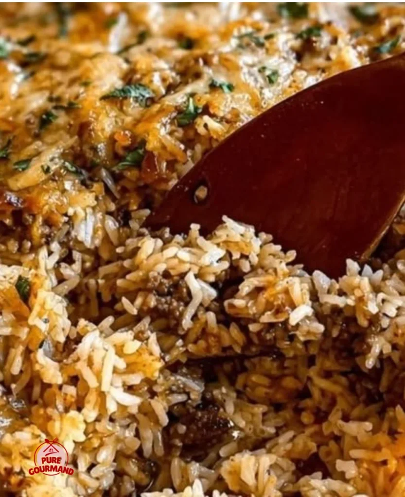 Creamy French onion casserole with ground beef and rice, baked to perfection.
