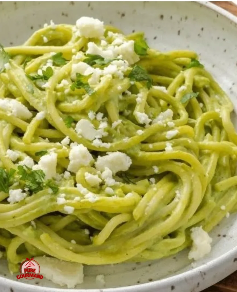 Creamy Mexican green spaghetti dish with fresh ingredients and vibrant colors.
