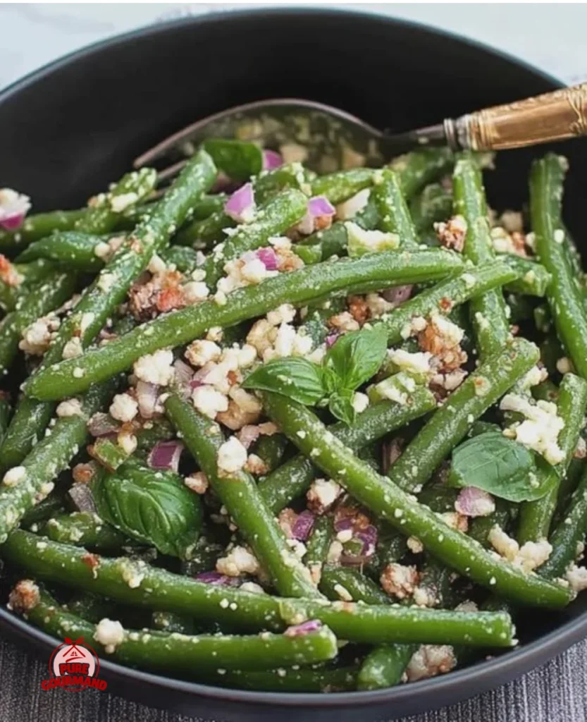 Crisp green bean salad topped with basil and parmesan cheese.