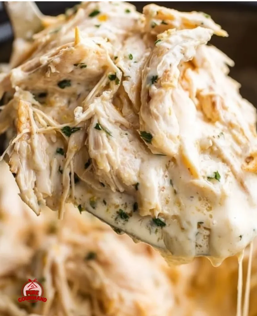 Crock Pot Creamy Italian Chicken dish ready to serve with herbs and spices