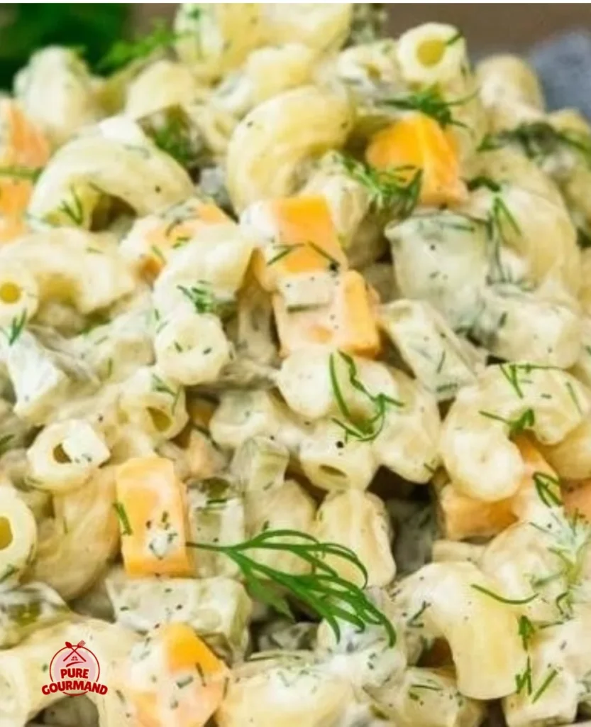 Bowl of Dill Pickle Pasta Salad with fresh ingredients and a creamy dressing.