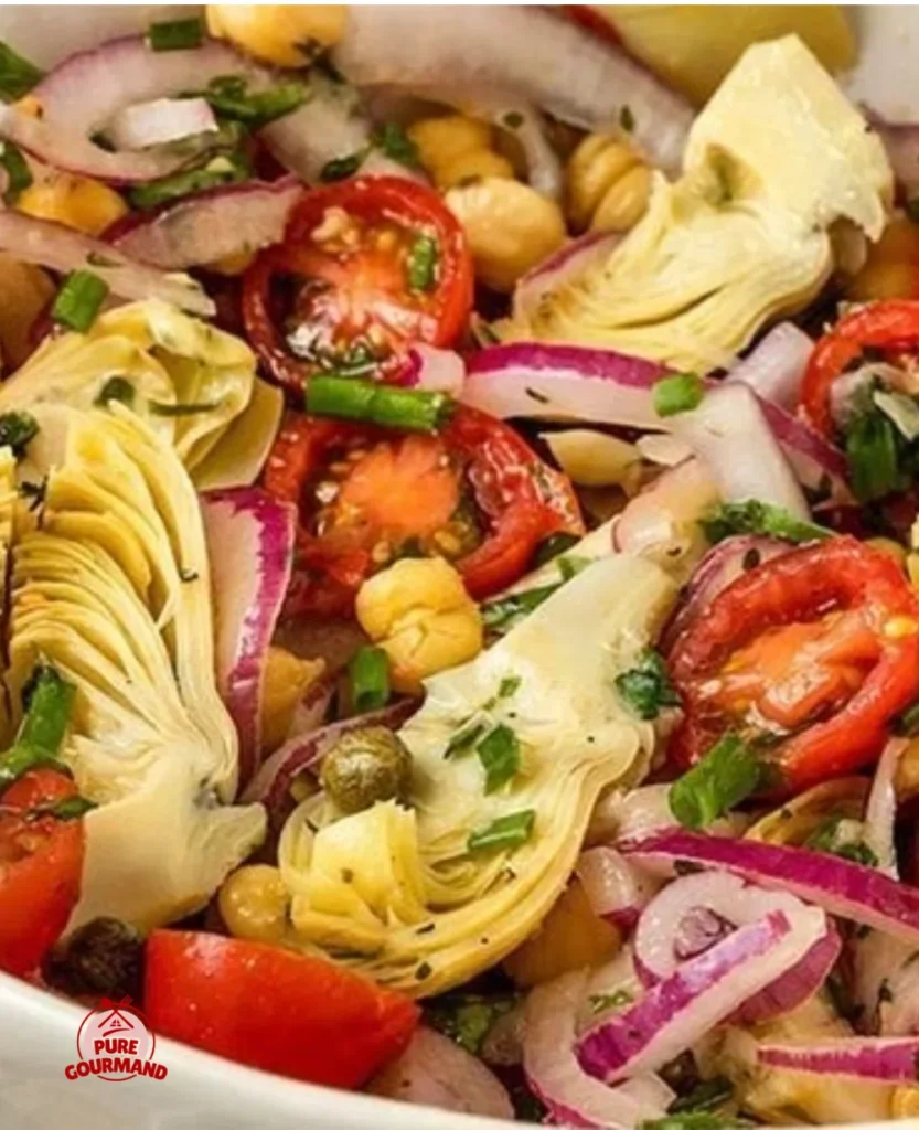 Vegan Tuscan Salad with artichokes and tomatoes on a rustic table