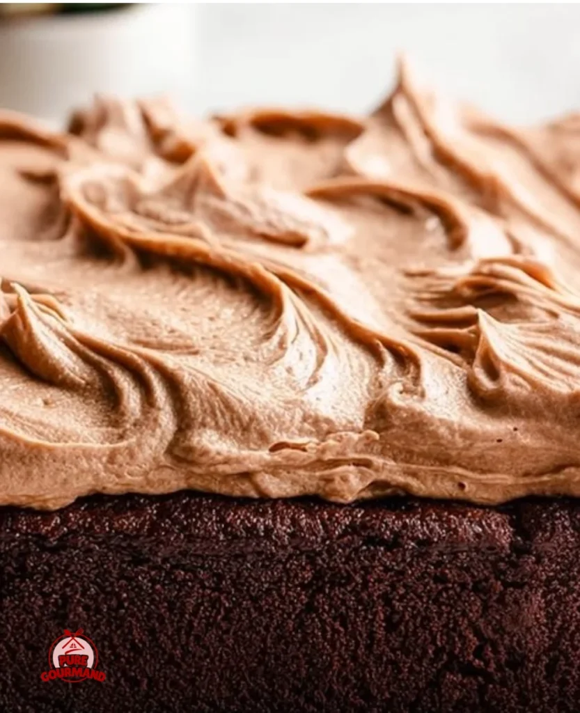 Classic zucchini cake with whipped cream frosting on a rustic wooden table