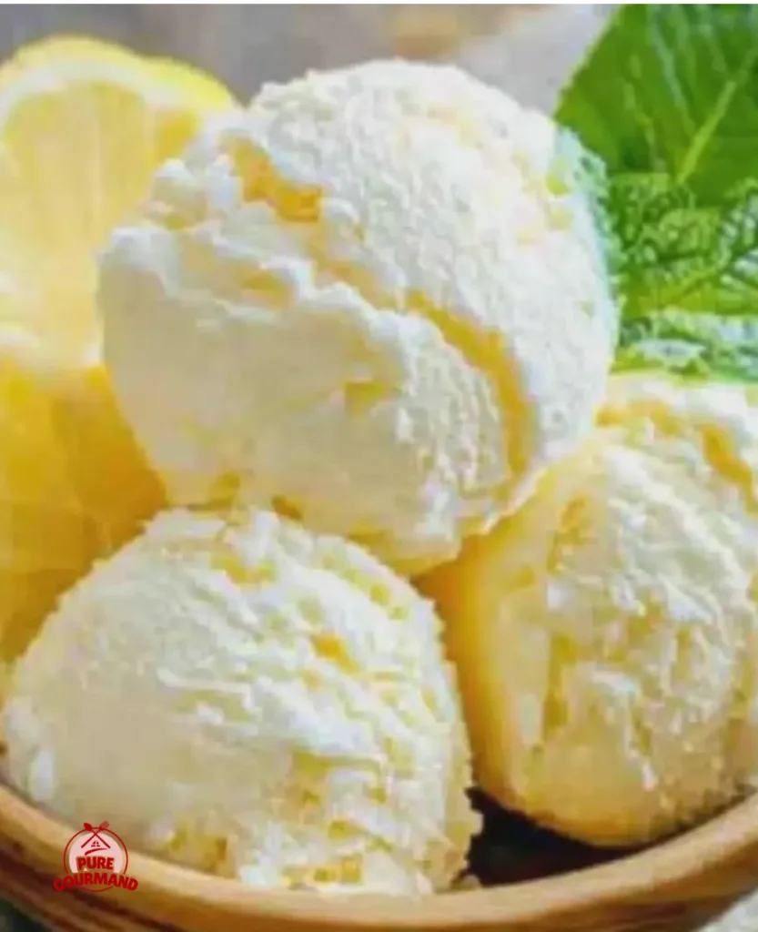 Delicious homemade lemon sorbet served in a bowl with fresh lemons