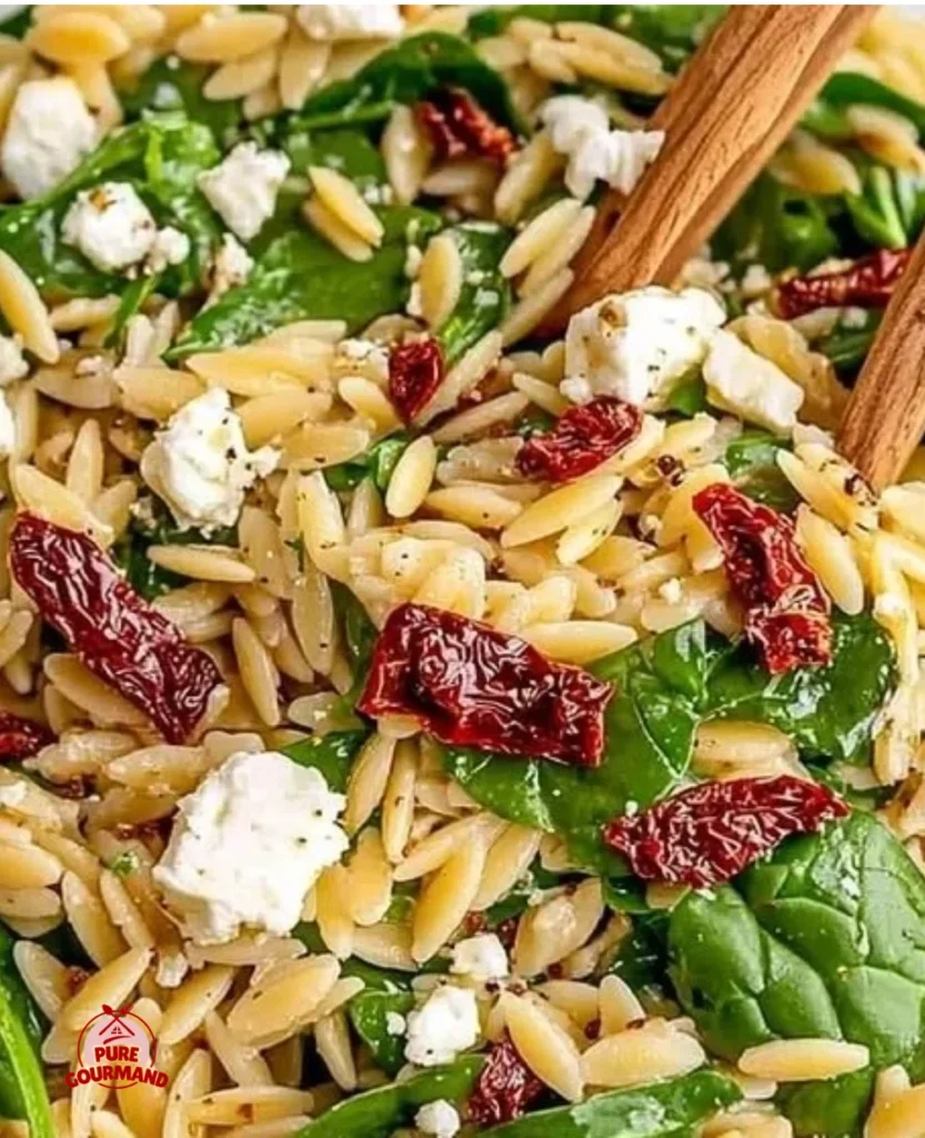 Colorful and nutritious balsamic orzo salad in a bowl with fresh vegetables.