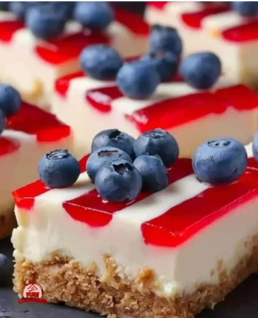 Patriotic cheesecake bars with red, white, and blue toppings for festive occasions
