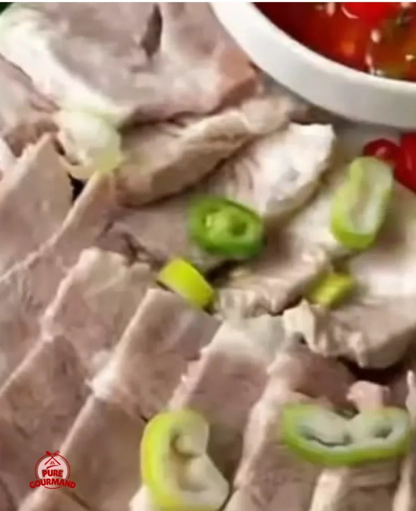 Sliced boiled pork with May Chang served on a plate