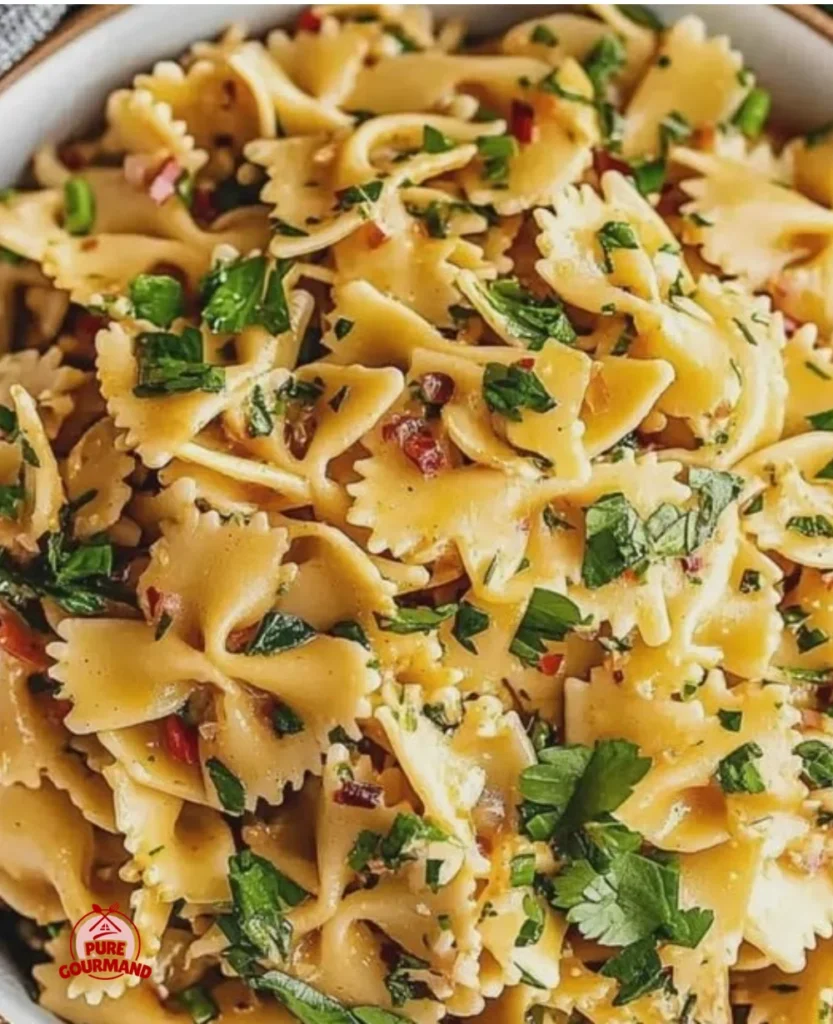 Spicy Thai Pasta Salad with lime, chili, and fresh veggies on a plate