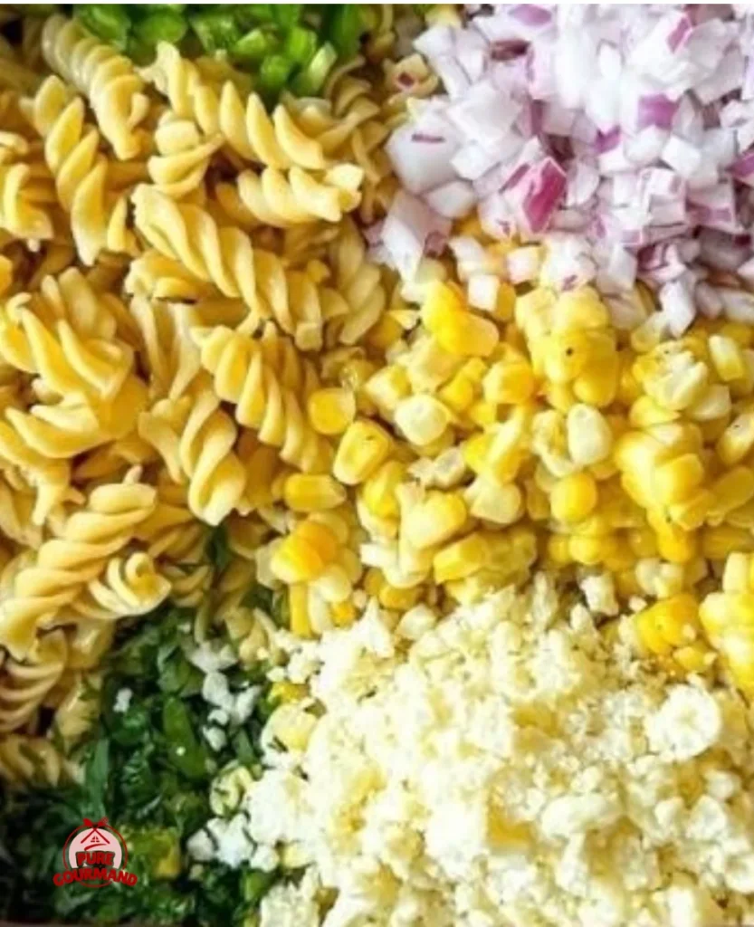 Delicious Street Corn Pasta Salad garnished with cilantro and lime.