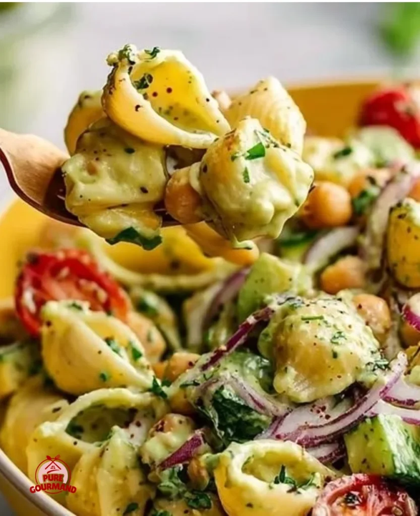 A bowl of Vegan Avocado Pasta Salad with colorful vegetables and high protein ingredients