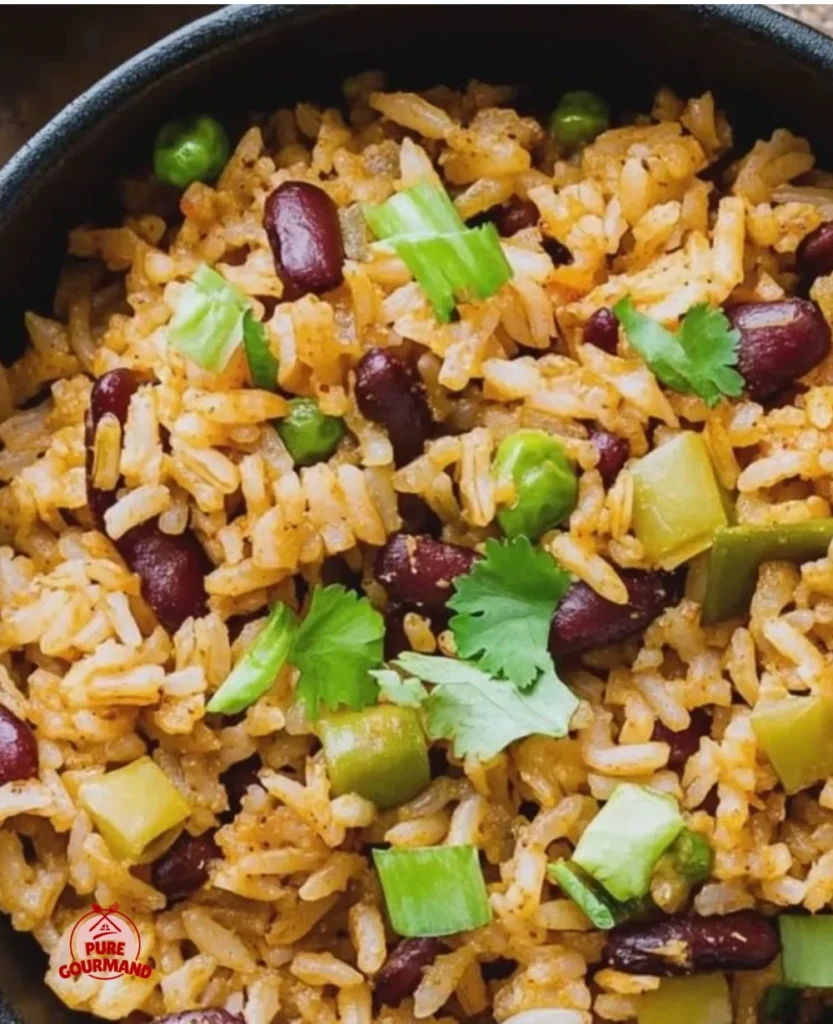 Bowl of colorful vegetarian dirty rice garnished with fresh herbs