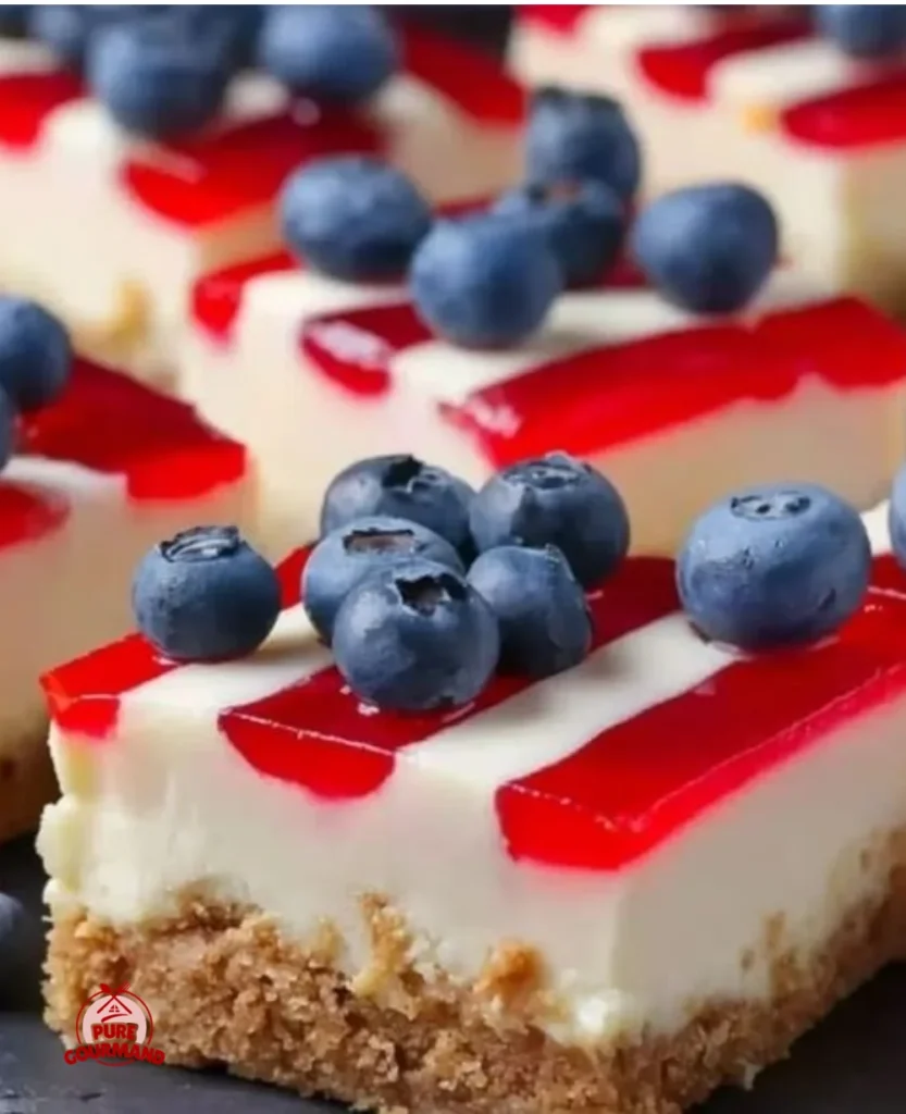 Patriotic cheesecake bars topped with red, white, and blue decorations