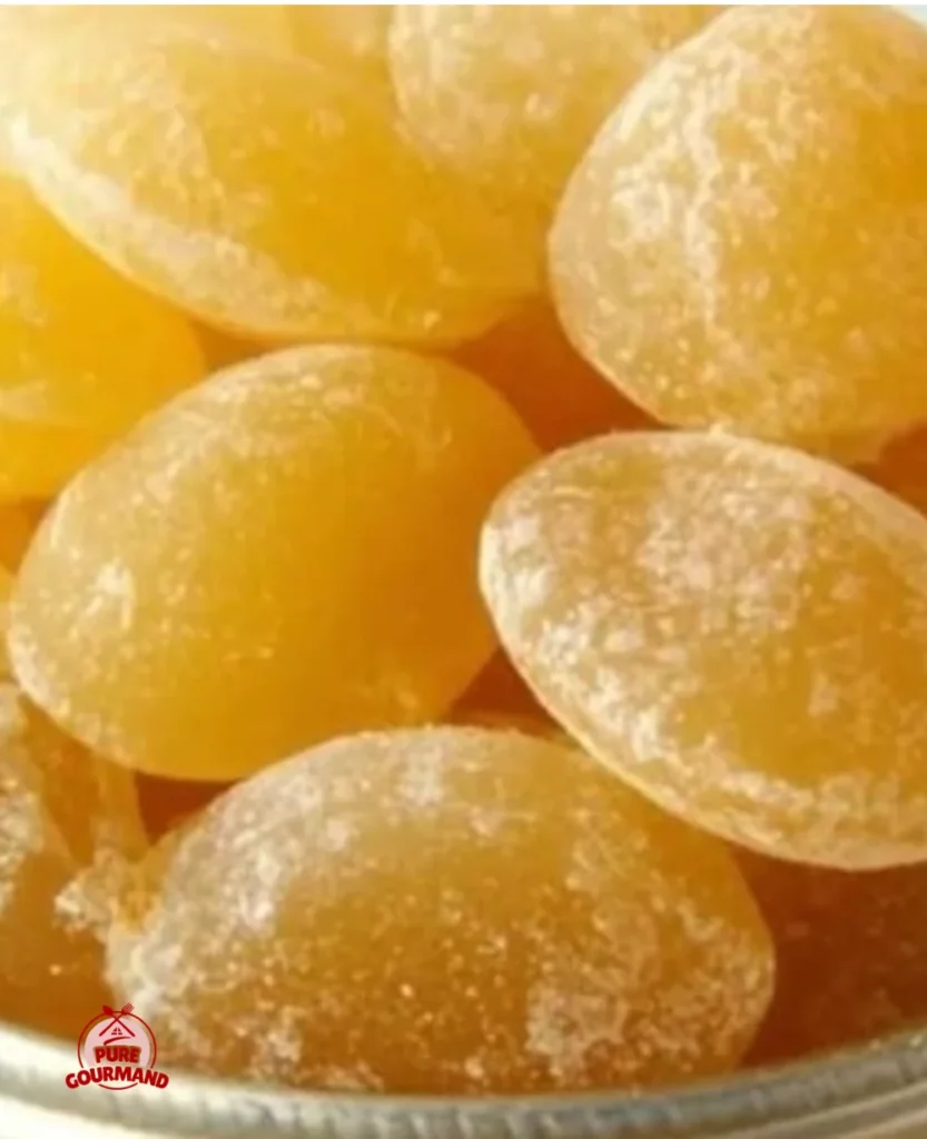 Bright and tangy lemon drops candy on a colorful background